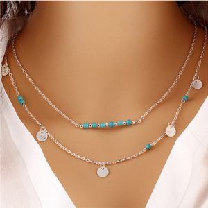 Collier double chaine avec pampilles et perles bleues